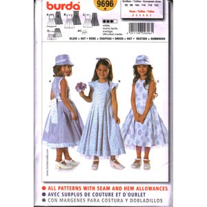 May include: A Burda 9696 sewing pattern envelope featuring illustrations of three variations of a sleeveless dress and a matching hat. The pattern includes sizes 92 to 122. The text on the envelope includes the brand name Burda, the pattern number 9696, and the phrase ALL PATTERNS WITH SEAM AND HEM ALLOWANCES.