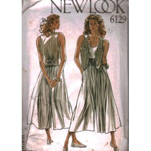 May include: A vintage sewing pattern from New Look, featuring illustrations of a woman in a sleeveless dress and a striped vest with a skirt. The pattern number is 6129. The dress has a cinched waist and a flowing skirt.