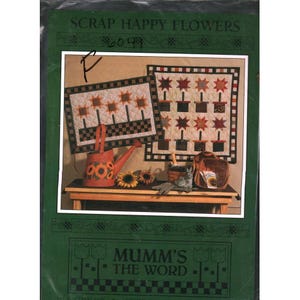 May include: A white ceramic mug with a black handle and the text "But First, Coffee" in a handwritten style. The mug is on a white surface. The mug is approximately 4 inches tall.