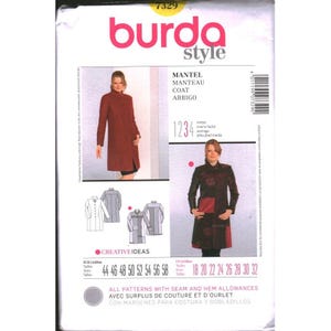 May include: A Burda Style 7329 sewing pattern envelope for a coat. The front displays two photographs of a person wearing the coat, along with technical line drawings of the garment. Text includes "MANTEL", "MANTEAU", "COAT", and "ABRIGO".