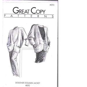 May include: A sewing pattern envelope titled Great Copy Patterns #890 featuring a black and white line drawing of two variations of a designer dolman jacket with long sleeves, front pockets, and a single button closure on the front.