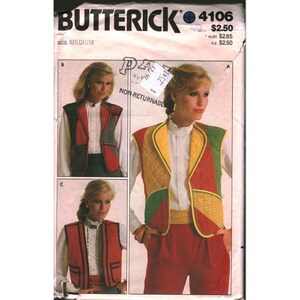 May include: Butterick 4106 sewing pattern envelope for a vest in size medium. The front displays three variations of a sleeveless vest worn over a white button-down shirt. The vests feature quilted panels in red, yellow, and green color blocks.