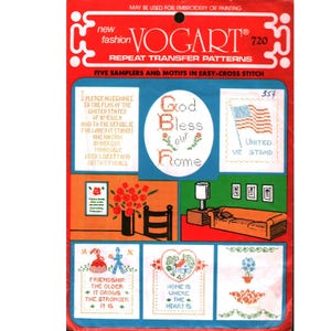 May include: A Vogart repeat transfer pattern packet featuring five samplers and motifs for embroidery or painting. The red and blue packaging displays cross-stitch designs including the Pledge of Allegiance, God Bless Our Home, and United We Stand.
