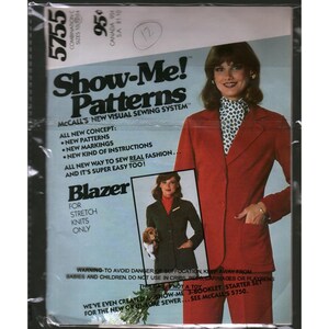 May include: A vintage McCall's Show-Me Patterns sewing envelope for a blazer, model 5755. The cover features a red blazer, a smaller inset image of a dark green blazer, and text including Show-Me Patterns, McCall's New Visual Sewing System.