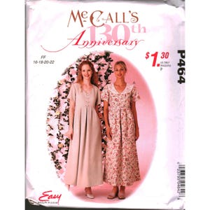 May include: McCall's 130th Anniversary sewing pattern P464 for two floor-length dresses. One dress is solid beige with a V-neck and front buttons, the other is a floral print with a white lace collar. Sizes 16-18-20-22 are listed on the envelope.