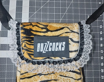 Monedero ajustable con estampado de tigre y encaje de Buzzcocks
