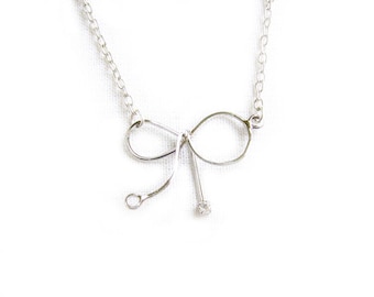 Silver Bow Necklace: Delicate Cubic Zirconia Ribbon Pendant