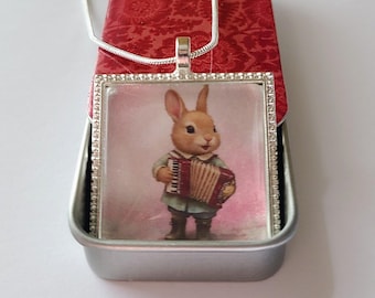 Pendant Necklace with Whimsical Bunny Rabbit Playing the Accordion & Colorful Red Floral Decorative Tin and 24" chain