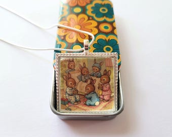 Pendant Necklace with Whimsical Bunnies in Pajamas & Hand-Decorated, Orange, Yellow and Blue Floral Decorative Glossy Resin Finish Gift Tin.