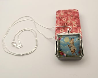 Pendant Necklace with Whimsical Bunny on Ladder to the Moon & Hand Decorated Pink and White Floral Decorative Glossy Resin Finish Gift Tin.