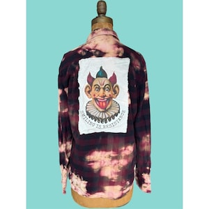 May include: A set of three ceramic mugs with a speckled, matte finish. The mugs are in shades of cream, light gray, and dark gray. Each mug has a simple, minimalist design and a rounded handle.