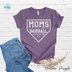 May include: A heather purple t-shirt with a white baseball diamond graphic that says "Moms Against White Baseball Pants".