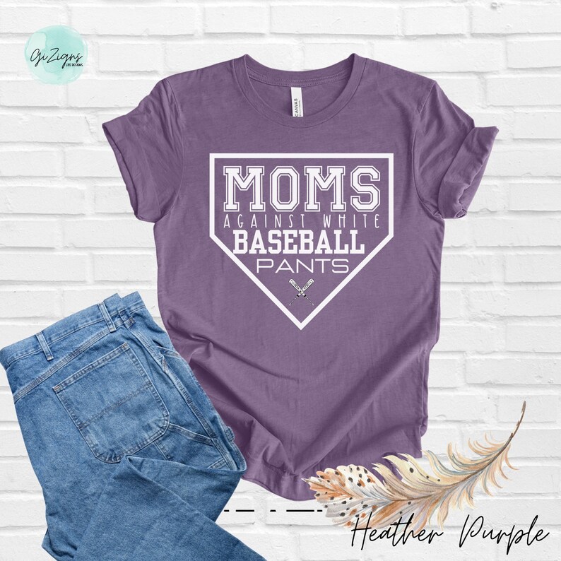 May include: A heather purple t-shirt with a white baseball diamond graphic that says "Moms Against White Baseball Pants".