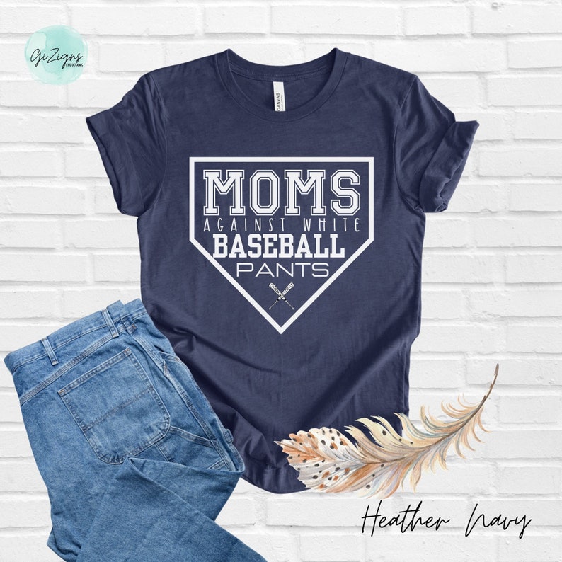 May include: A navy blue t-shirt with a white baseball diamond graphic that says "Moms Against White Baseball Pants".