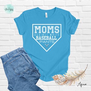 May include: A light blue t-shirt with a white baseball diamond graphic that says "MOMS AGAINST WHITE BASEBALL PANTS".