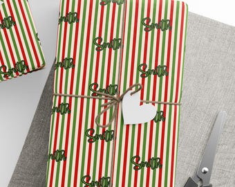May include: Red and green striped wrapping paper with the word "Smith" repeated in a green cursive font.