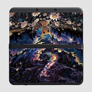May include: Black Nintendo 3DS console with a custom skin. The top half features a forest scene with daisies and a cartoon character. The bottom half displays a colourful galaxy design. The console is a handheld gaming device.