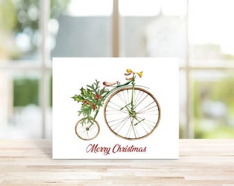 May include: A green vintage bicycle with a large front wheel decorated with holly and red berries. The bicycle has a yellow bell and the text "Merry Christmas" is printed below the bicycle.