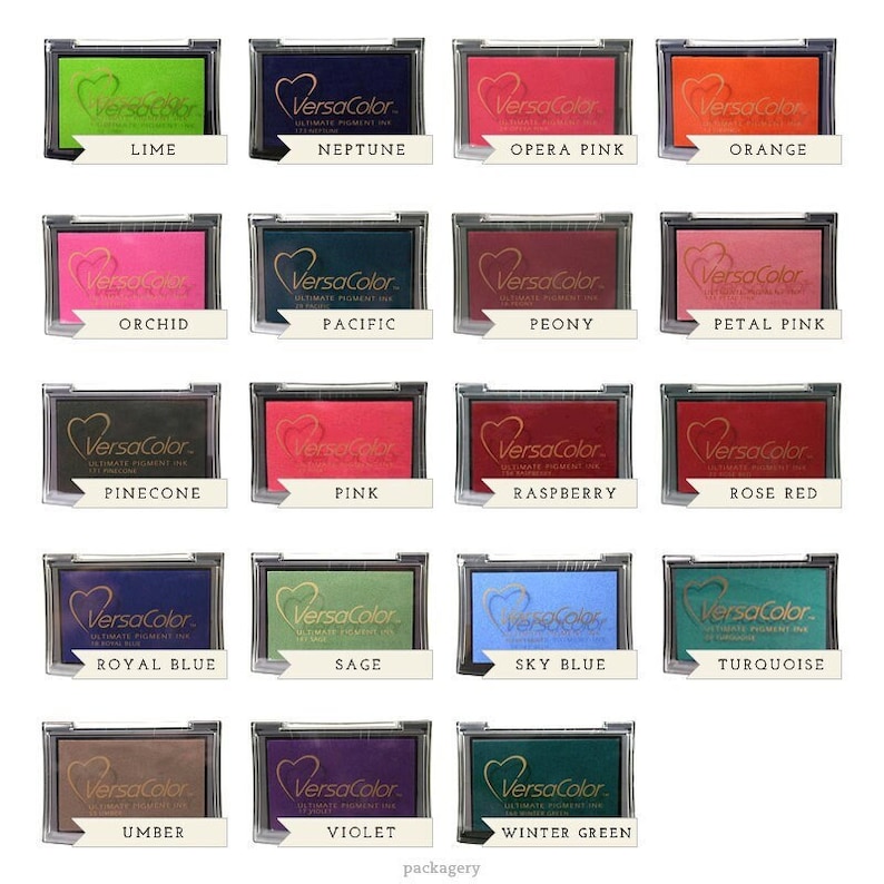 May include: A set of 16 ink pads in various colors, including lime, orchid, pine cone, royal blue, umber, violet, and winter green. Each pad features the VersaColor logo and the color name.