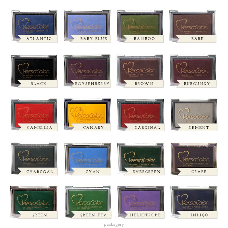 May include: A set of 20 ink pads in various colors, each with the brand name "VersaColor" and the color name printed below. The ink pads are arranged in a grid of four rows and five columns.