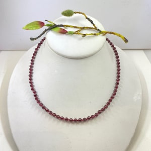 Exquisite garnet beaded and hand knotted necklace. Finished with a quality sterling silver lobster clasp.