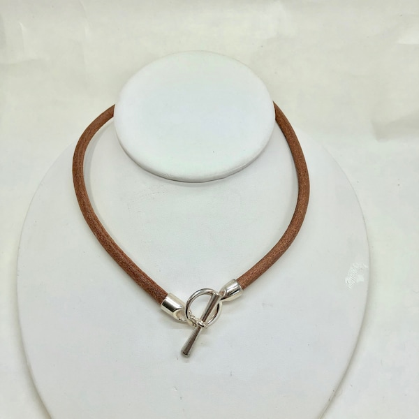 Beautiful Italian brown leather choker necklace fashioned with a center silver toggle clasp.