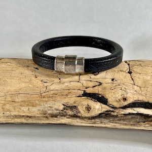 Leather cuff bracelet, made of fine black Italian detailed leather, finished with a strong silver magnetic clasp.