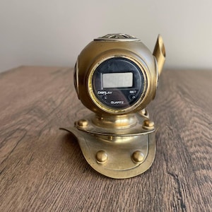 Vintage alarm clock in the form of a diving helmet, brass