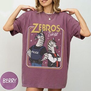 May include: A set of three ceramic mugs with a speckled, matte finish. The mugs are in shades of cream, light gray, and dark gray. Each mug has a simple, minimalist design, perfect for coffee or tea.