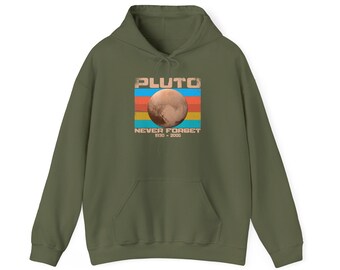May include: An olive green hooded sweatshirt featuring a central graphic of the planet Pluto. The design includes horizontal stripes in blue, orange, and yellow, with the text PLUTO NEVER FORGET 1930-2006 printed in a distressed font.