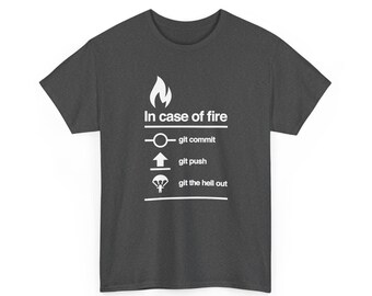 May include: A dark grey short-sleeve t-shirt featuring a white graphic with a flame icon and the text In case of fire, followed by three lines: a circle icon with git commit, an upward arrow with git push, and a parachute icon with git the hell out.