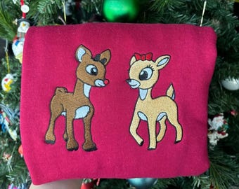 Rudolph Christmas Embroidered T-Shirt, Rudolph and Clarice Embroidery Christmas Sweater, Red Nose Reindeer Movie Xmas Hoodie, Christmas Gift