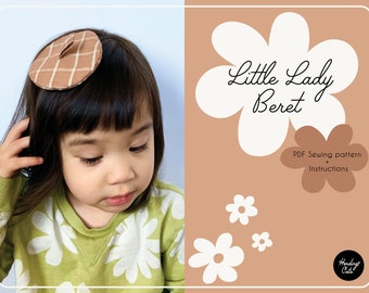 May include: A child wearing a brown plaid beret hair clip. The image includes the text "Little Lady Beret" and "PDF Sewing pattern + Instructions" on a light brown background with white flower graphics.