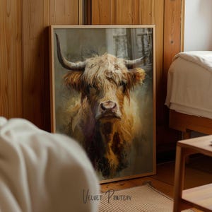 May include: A framed print featuring a detailed portrait of a Highland cow. The artwork showcases the cow's shaggy, light brown fur and large horns. The print is set in a wooden frame, adding a rustic touch to the artwork.
