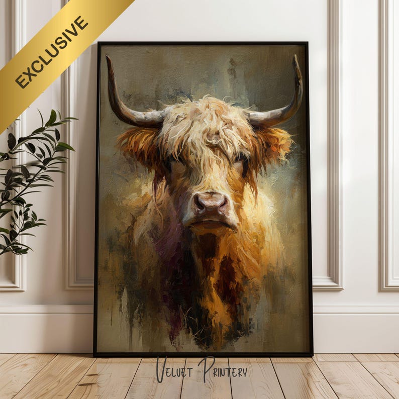 May include: A framed art print featuring a detailed portrait of a Highland cow. The artwork showcases the animal's shaggy, light brown fur and large horns against a muted background. The word "EXCLUSIVE" is printed on a gold banner in the upper left corner.