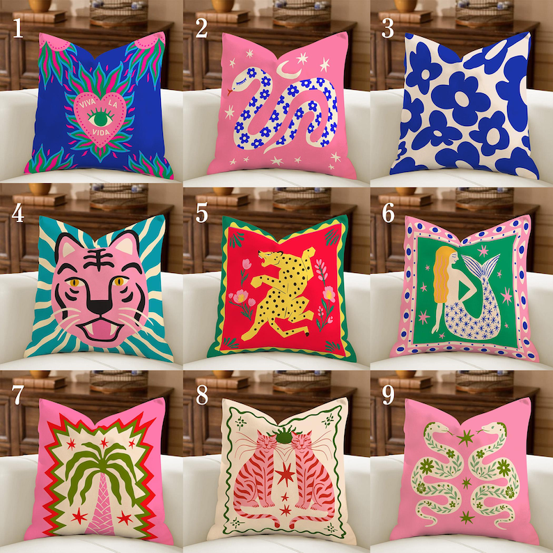 May include: A collection of decorative throw pillows with vibrant designs. Pillows feature various patterns, including a snake, tiger, flowers, and a mermaid. Colors include pink, blue, green, and red. Each pillow has a unique, eye-catching design, perfect for adding a pop of color to any room.