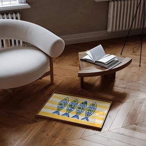 May include: A rectangular decorative tray with a yellow and white striped background. Four stylized fish with blue tails and floral patterns are arranged across the tray. The tray has a wooden frame and sits on a wooden floor.