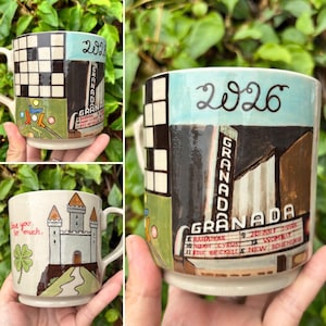 May include: Hand-painted ceramic mugs with unique designs. One mug features a checkerboard pattern, the word "GRANADA", and the number "2026". Another mug displays a castle with the text "love you so much" and a four-leaf clover.