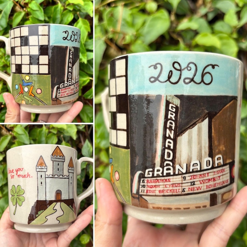 May include: Hand-painted ceramic mugs with unique designs. One mug features a checkerboard pattern, the word "GRANADA", and the number "2026". Another mug displays a castle with the text "love you so much" and a four-leaf clover.
