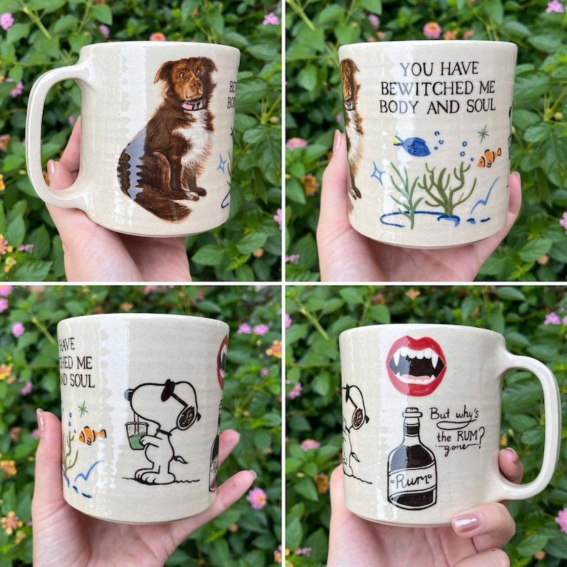 May include: Four ceramic mugs with unique designs. One mug features a dog illustration, another has the text "You have bewitched me body and soul", a third has a Snoopy illustration, and the last has a vampire mouth and a rum bottle.
