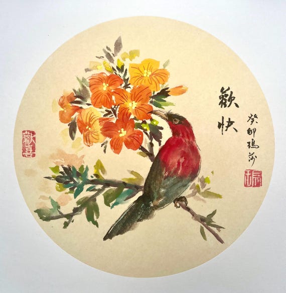 Orange trumpet flower and a bird