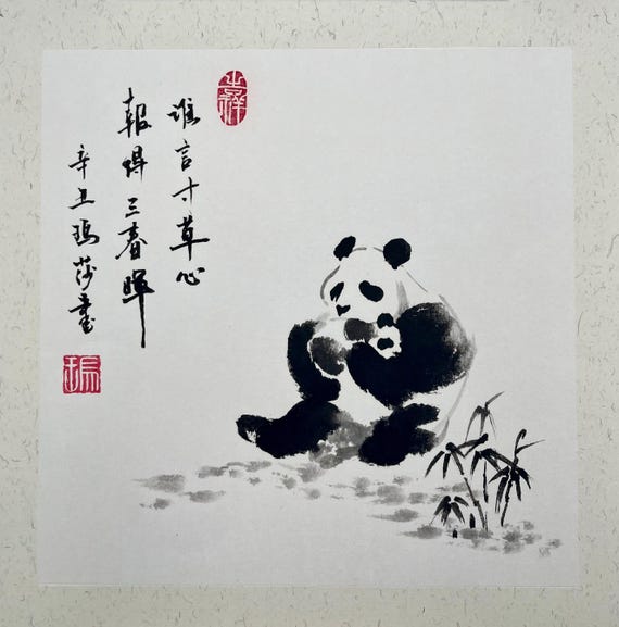 Panda bear mom and a cub