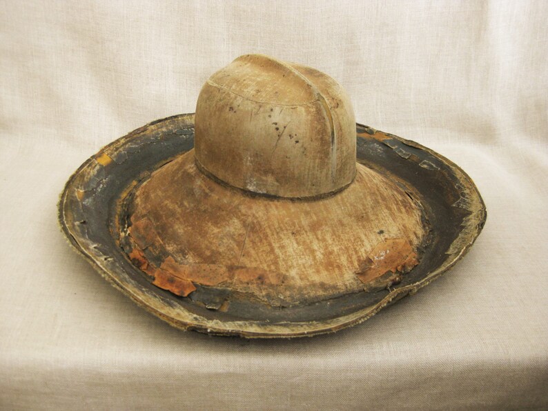 This is a terrific and very rare Vintage Hat Mold. This Antique Milliner's Millinery Block Form is made from Vulcanized Rubber which has a fused canvas covered surface. This one looks like a Fedora.