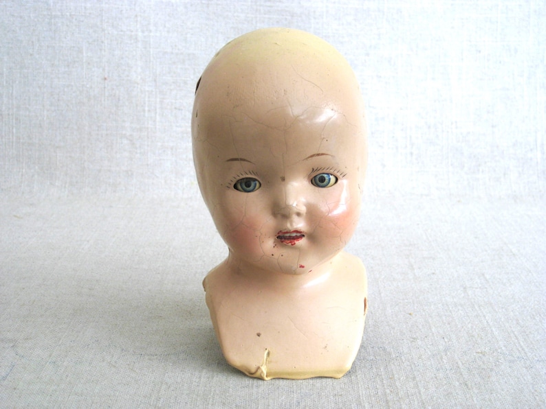 Terrific Vintage Composite Doll Head with "Shoulder Yoke. Bright Blue weighted Sleepy Eyes, perfect for all kinds of uses, from adding to a collection, to Halloween décor, or as Doll Parts and Supplies for Doll Repair to Assemblage Sculpture. Listing is for 1 doll head, other props are NOT included.