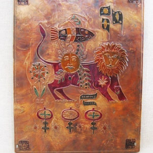 May include: A copper wall hanging with a stylized lion, sun, and fish design. The lion is red, the sun is yellow, and the fish is black, white, and red. The background is a mottled copper color.