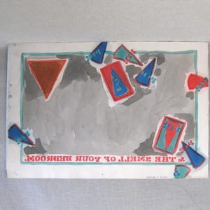 May include: A watercolor painting with a gray background and colorful geometric shapes. The shapes are red, blue, and orange. The text at the bottom of the painting reads "The Smile of the Moon Seen by You".
