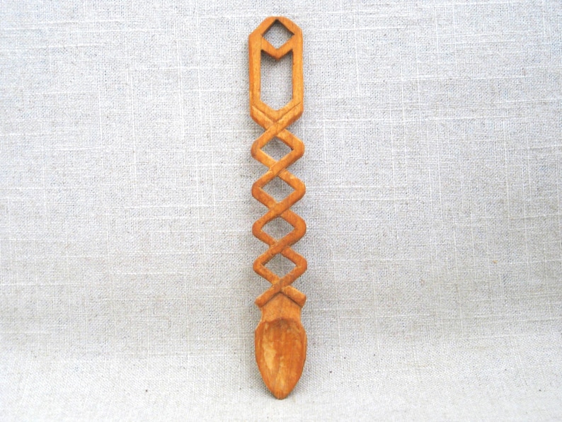 Hand Carved Wooden Spoon. Folk Art Spoon, often referred to as Loving Spoons: A wooden spoon,  carved by a Welsh suitor as an engagement gift for his promised bride. Delightful Intertwined Design. Signed w initials, FR, dated 1994 on bottom of bowl.