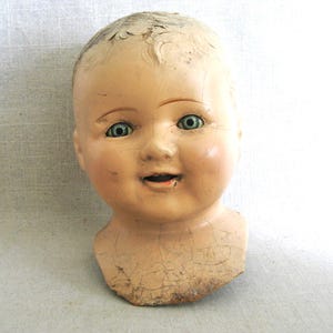Terrific Large Vintage Composite Doll Head, with Shoulder Yoke. Bright Blue Sleepy Eyes. Perfect for all kinds of uses, from adding to a collection, to Halloween décor, or as Doll Parts and Supplies for Doll Repair to Assemblage Sculpture. Listing is for 1 doll head, other props are NOT included.