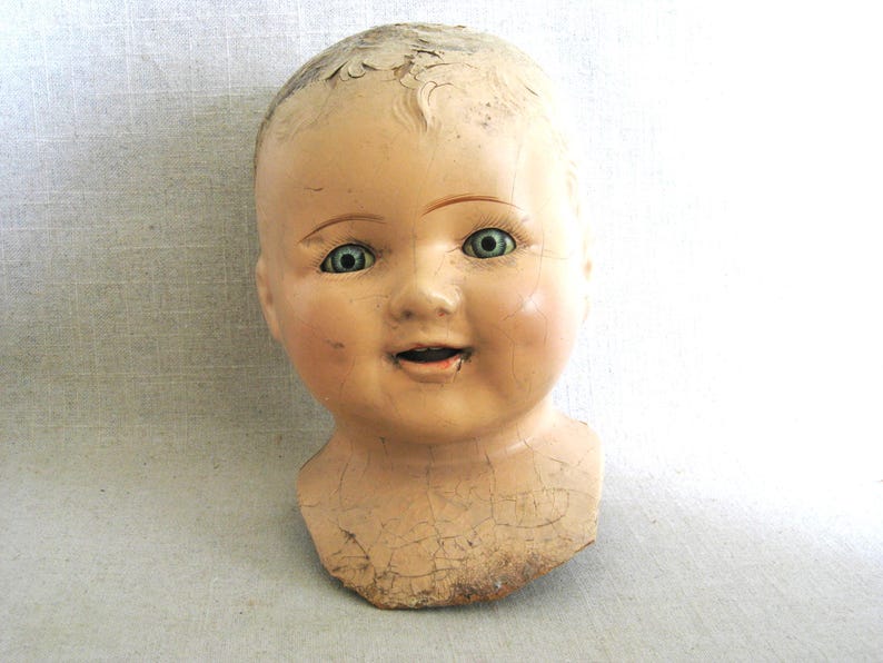 Terrific Large Vintage Composite Doll Head, with Shoulder Yoke. Bright Blue Sleepy Eyes. Perfect for all kinds of uses, from adding to a collection, to Halloween décor, or as Doll Parts and Supplies for Doll Repair to Assemblage Sculpture. Listing is for 1 doll head, other props are NOT included.