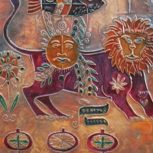 May include: A copper relief sculpture with a lion, a sun, and a fish. The lion is red, orange, and brown. The sun is yellow and has a human face. The fish is black, orange, and white. The background is a copper color with a floral design.
